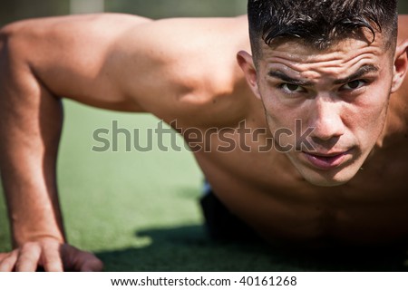 A shot of a hispanic athlete doing a push-up