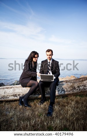 A shot of two business colleagues working together outdoor