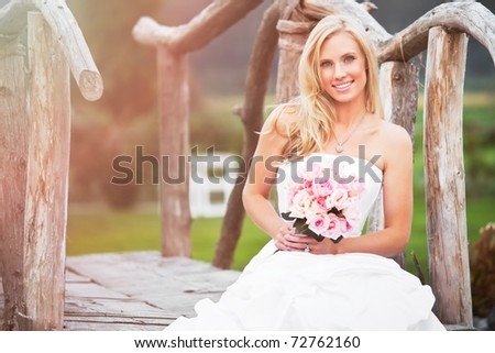 A shot of a beautiful caucasian bride sitting outdoor