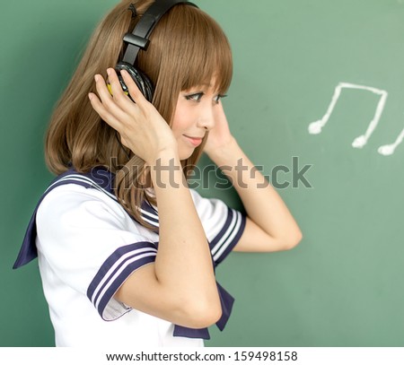 Asin girl in student sailor suit  japanese style listen to music