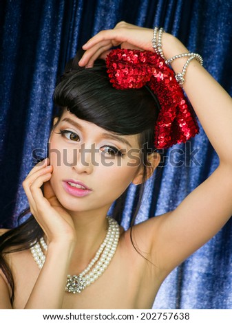 Young fashion asian model with cosmetic