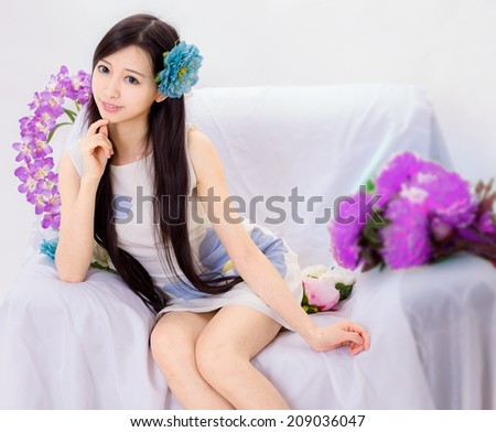 girl sitting on flower sofa
