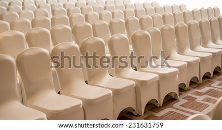 a few rows of theater empty chairs background