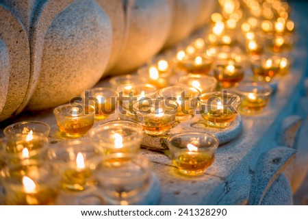 Burning candles at a Buddhist temple asian china