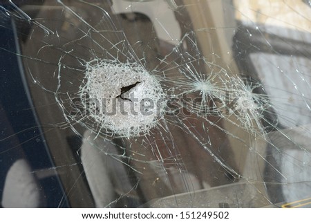 The broken glass of the car close up.