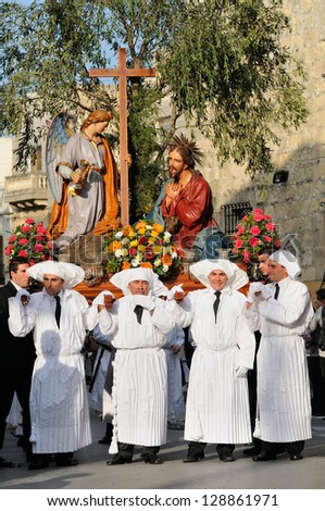 MOSTA, MALTA - APR 22 - Unidentified people in Biblical enactment of the passion during in the Good Friday procession in the village of Mosta in Malta April 22, 2011