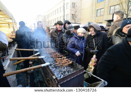 VILNIUS, LITHUANIA - MARCH 2: Unidentified people trades food in annual traditional crafts fair - Kaziuko fair on Mar 2, 2013 in Vilnius, Lithuania