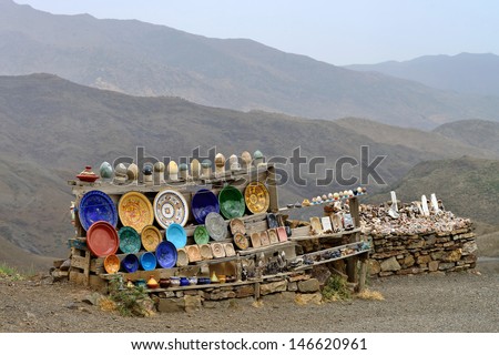 ATLAS, MOROCCO - JULY 10: Souvenirs stand on the side of the road on July 10, 2013 in Atlas Mountains, Morocco. Road in Atlas Mountains very popular tourist route in central Morocco.