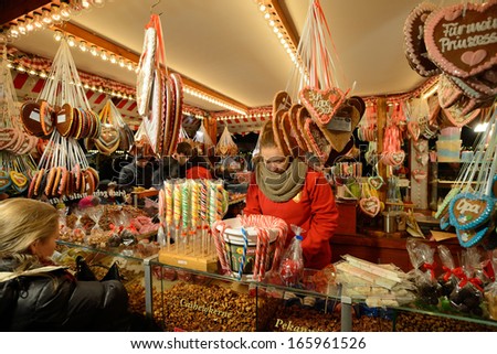 BERLIN - NOVEMBER 23: Unidentified people trades food in annual traditional Christmas fair in Potsdamer Platz (Potsdam Square) on 23 November 2013 in Berlin, Germany.