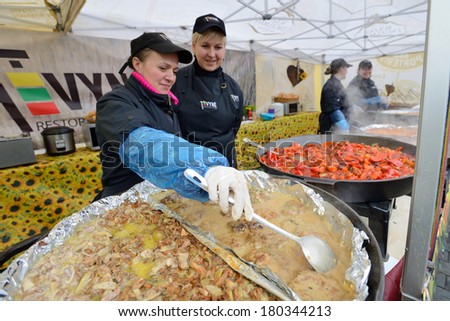 VILNIUS, LITHUANIA - MARCH 7: Unidentified people trade food in annual traditional crafts fair - Kaziuko fair on Mar 7, 2014 in Vilnius, Lithuania