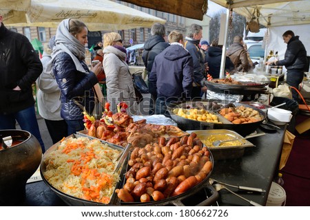 VILNIUS, LITHUANIA - MARCH 8: Unidentified people trade food in annual traditional crafts fair - Kaziuko fair on Mar 8, 2014 in Vilnius, Lithuania