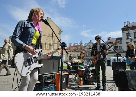 VILNIUS, LITHUANIA - MAY 17: Unidentified musician sing and play guitar in Street music day on May 17, 2014 in Vilnius. Its a most popular event on May in Vilnius, Lithuania
