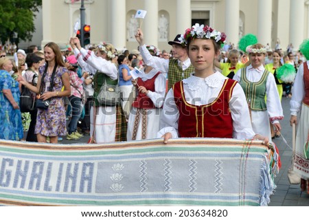 VILNIUS, LITHUANIA - JULY 6: Unidentified peoples parade in traditional Lithuanian Song Celebration on July 6, 2014 in Vilnius, Lithuania