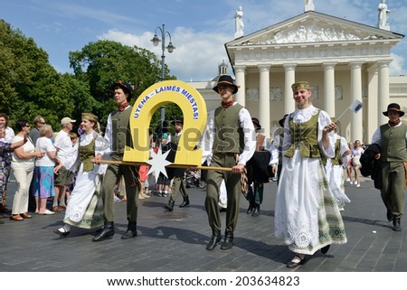 VILNIUS, LITHUANIA - JULY 6: Unidentified peoples parade in traditional Lithuanian Song Celebration on July 6, 2014 in Vilnius, Lithuania