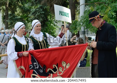 VILNIUS, LITHUANIA - JULY 6: Unidentified peoples in traditional Lithuanian Song Celebration on July 6, 2014 in Vilnius, Lithuania. Song Festival is Lithuania's main cultural event for 2014.