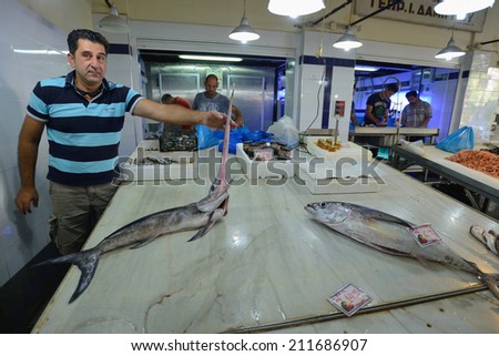 CHANIA, GREECE - AUGUST 12: Unknown people sell freh fish in Chania, Crete, Greece on 12 August 2014. The cross-shaped market (Agora) of Chania was built in 1911-1913.