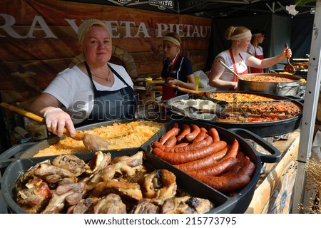 VILNIUS, LITHUANIA - SEPTEMBER 7: Unidentified people trade food in annual traditional crafts fair - Days of the Capital City on September 7, 2014 in Vilnius, Lithuania