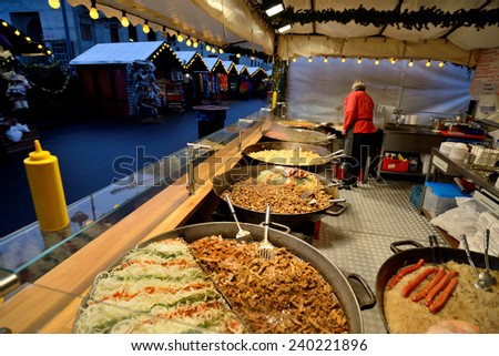 BERLIN - DECEMBER 25: Unidentified people trade food in annual traditional Christmas fair on 25 December 2014 in Berlin, Germany.