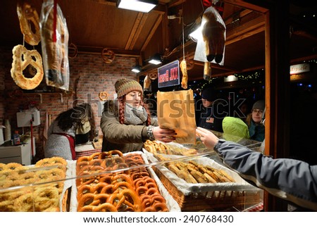 BERLIN - DECEMBER 26: Unidentified people trade food in annual traditional Christmas fair in Alexanderplatz on 26 December 2014 in Berlin, Germany.