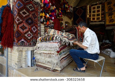 SHIRAZ - APRIL 14: Traditional iranian carpets in a market (Vakil Bazaar) in Shiraz, Iran on April 14, 2015. Vakil Bazaar is the most important tourist attraction in Shiraz, Iran.