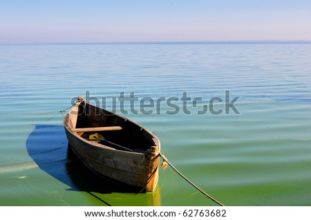 Old fishing boat floating on the water