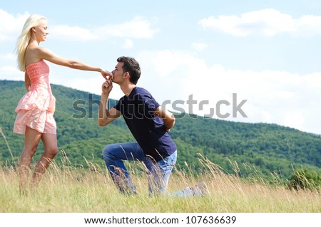 Boyfriend kiss girl hand in nature