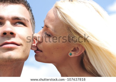 Girl bite on boyfriend ear