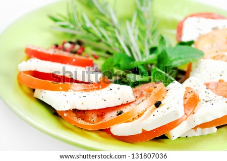 Food plate with cheese and tomato mix