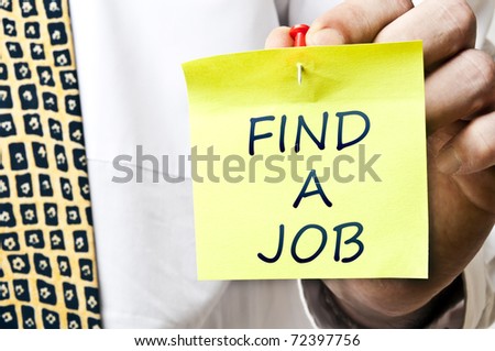 Find a job post it in business man hand