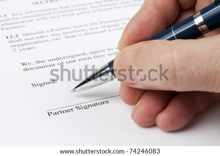 Close-up to contract on signature