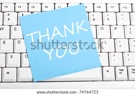 Thank you note on an white keyboard