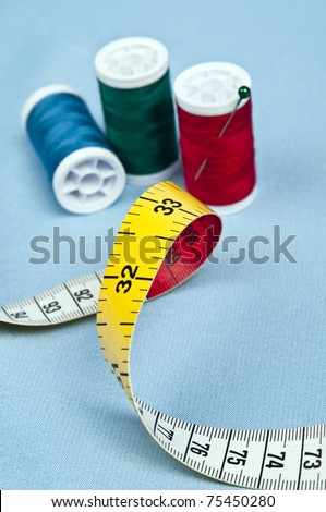 Tailor tools on blue material background