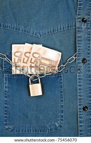 Jeans shirt pocket with money and padlock