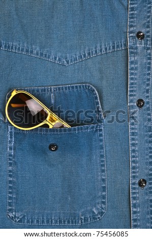 Jeans shirt pocket with sun glasses