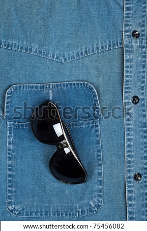 Jeans shirt pocket with sun glasses