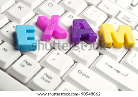 Exam word made by colorful letters on keyboard