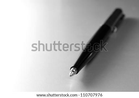 pen for writing on a gray gradient background