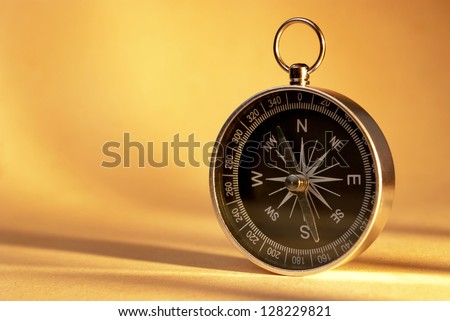 compass indicates the direction of movement and the old paper background