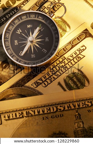 compass indicates the direction and the U.S. dollar