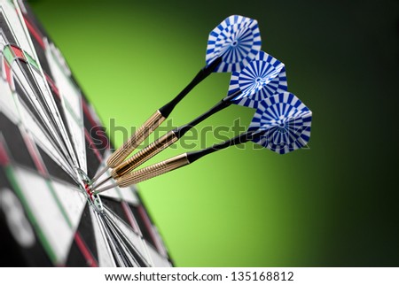 darts arrows in the target center