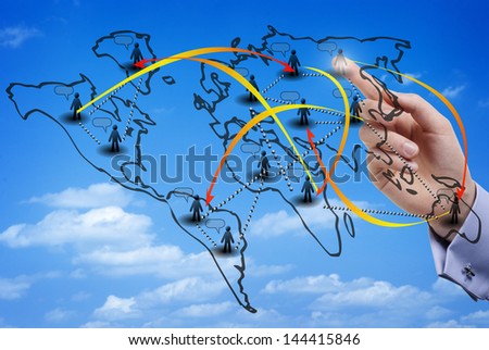 Finger touching a virtual map of an international social network made of members from all over the world, with the sky as background