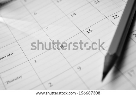 Pencil Lying On A Calendar Showing Different Dates And Days Conceptual Of Schedules, Time Management, Events, Deadlines And Organisation