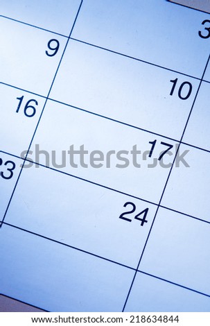 Blank calendar with generic date squares with a highlight over the 17th and copyspace, closeup view from above