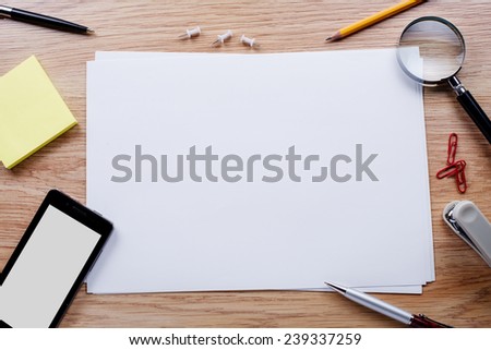 Office stationery and mobile phone on the table with copy space for texts