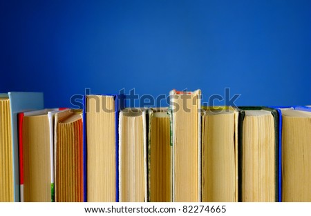 a lot of books on a blue background