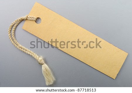 Label with a string on a gray background