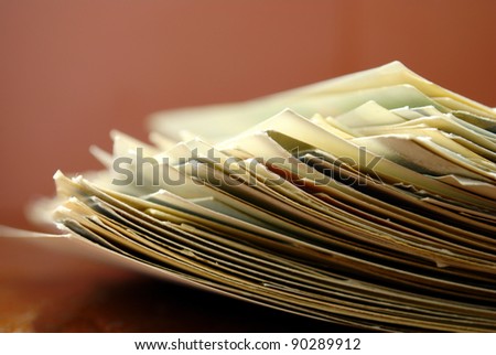 old paper on brown background composed of a stack of
