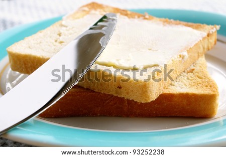 toasted bread and butter in a bowl on the table