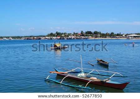 fishing boats in bay walk, palawan, philippines