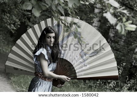 girl with the fan in the park